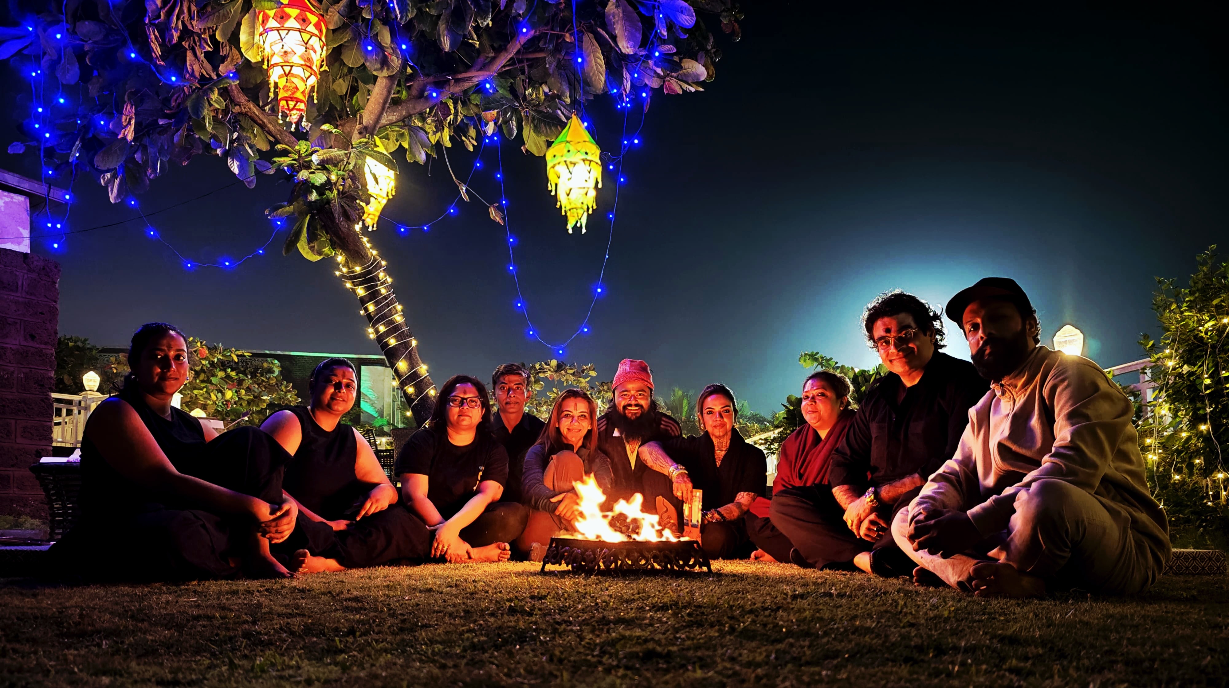The Saptarishis — first cohort of Agnikula around the fire at Mayfair Heritage, Puri, December 2025